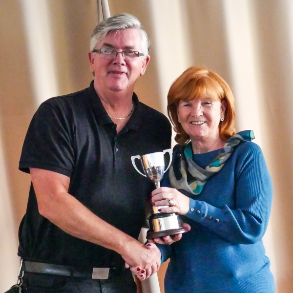 Vi Richards (Bury)  receiving the Short AC league trophy from Fed Chairman Paul Rigge