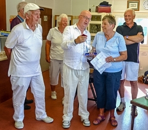 Garry Greenwood receiving the winner’s trophy from Maggie Cowman and being congratulated by former club chairman David Guyton